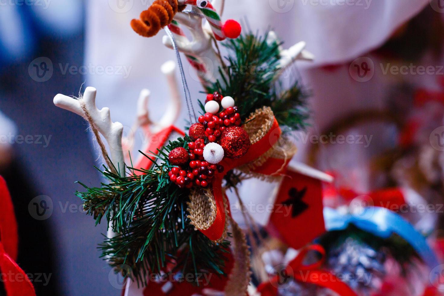 Christmas decoration and ornaments on rustic wooden background. Retro style dark colored picture with light effects photo