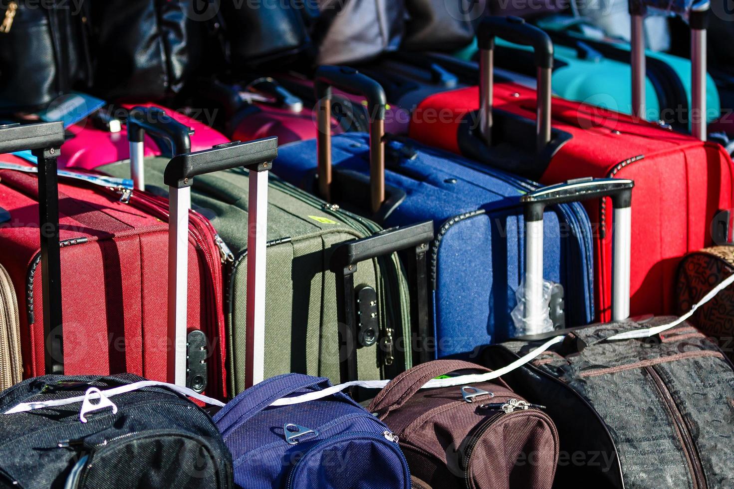 Many travel suitcases photo