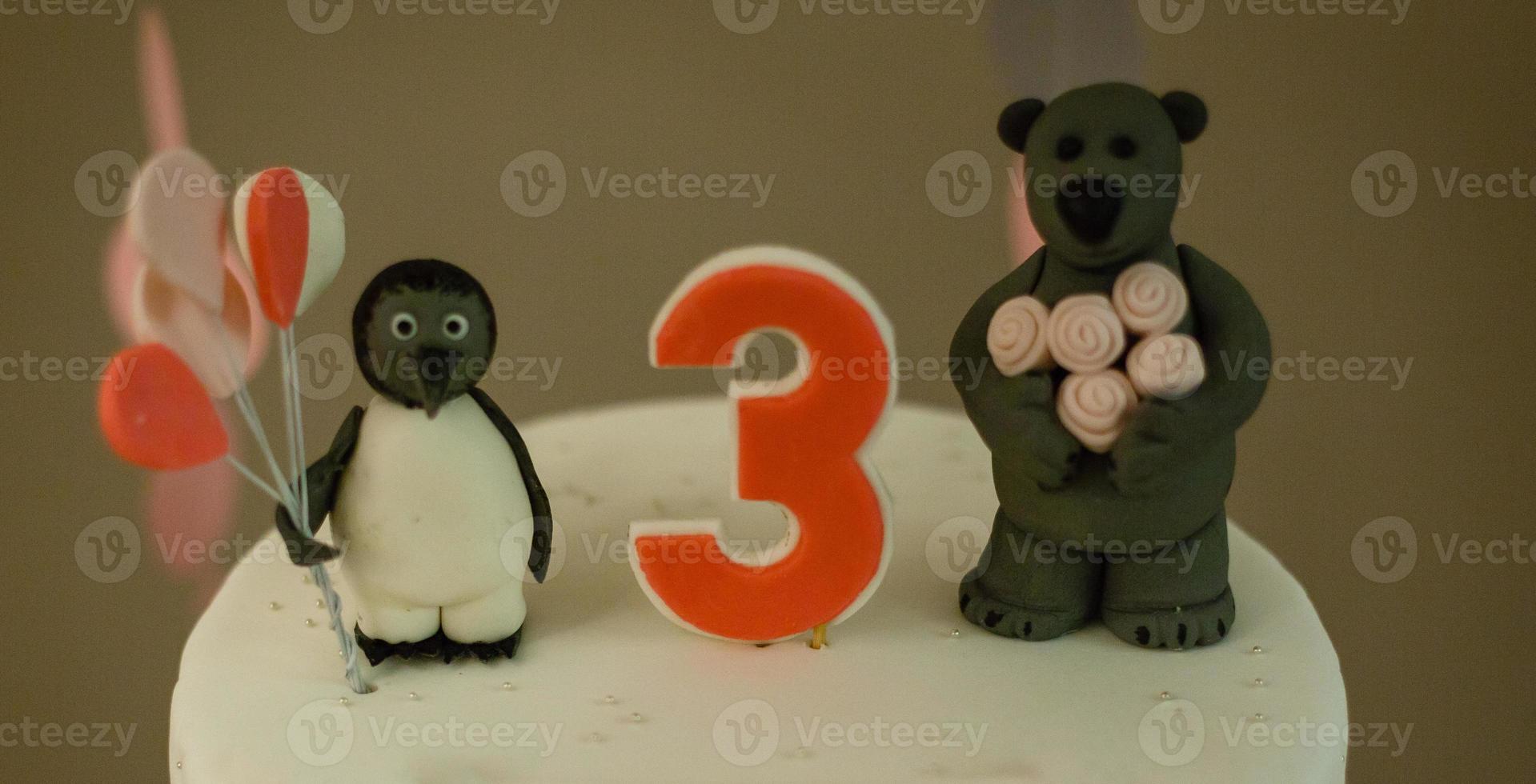 Happy birthday cake with number 3 pink on white tabel photo