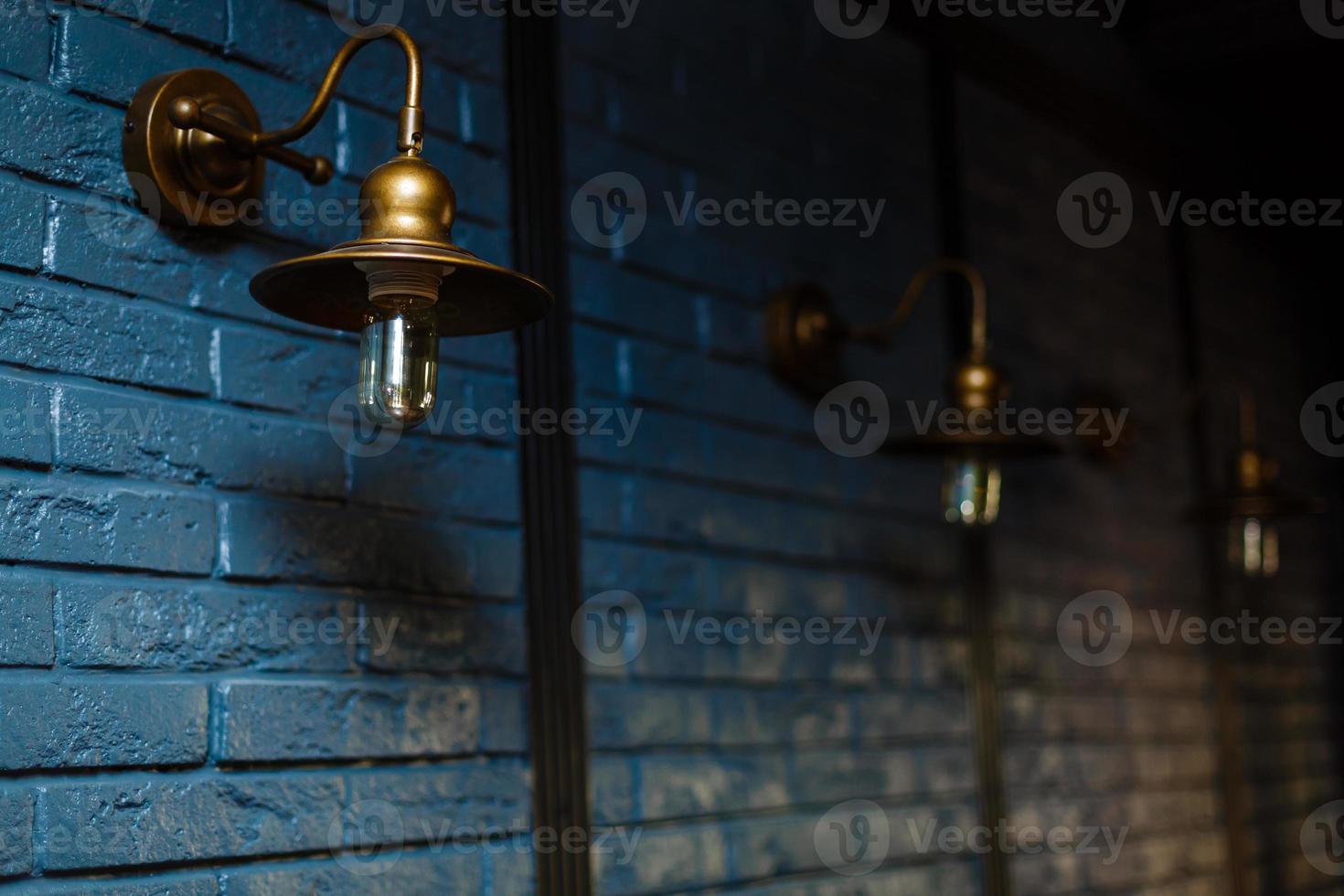 Close-up view of an antique lamp on a wall photo