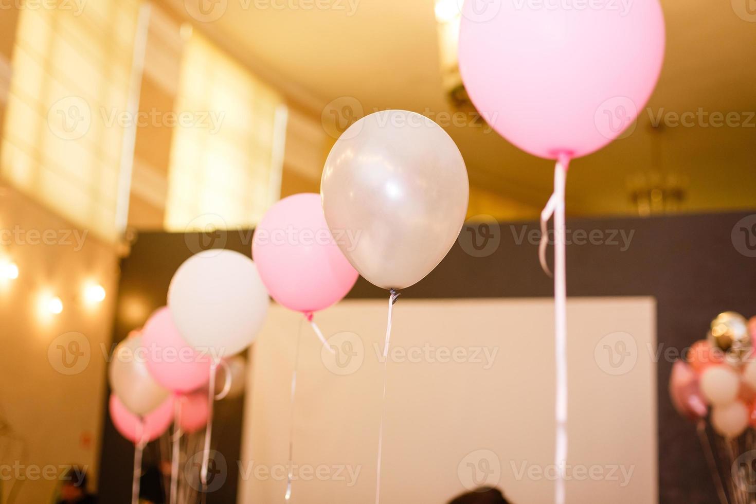 Decorations on birthday. White and pink balloons. photo