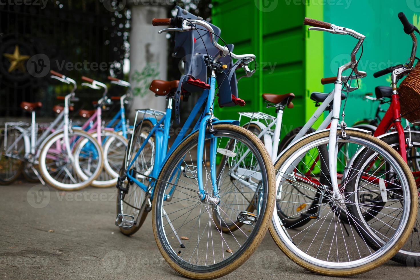 Group of bicycles in the row for rent photo