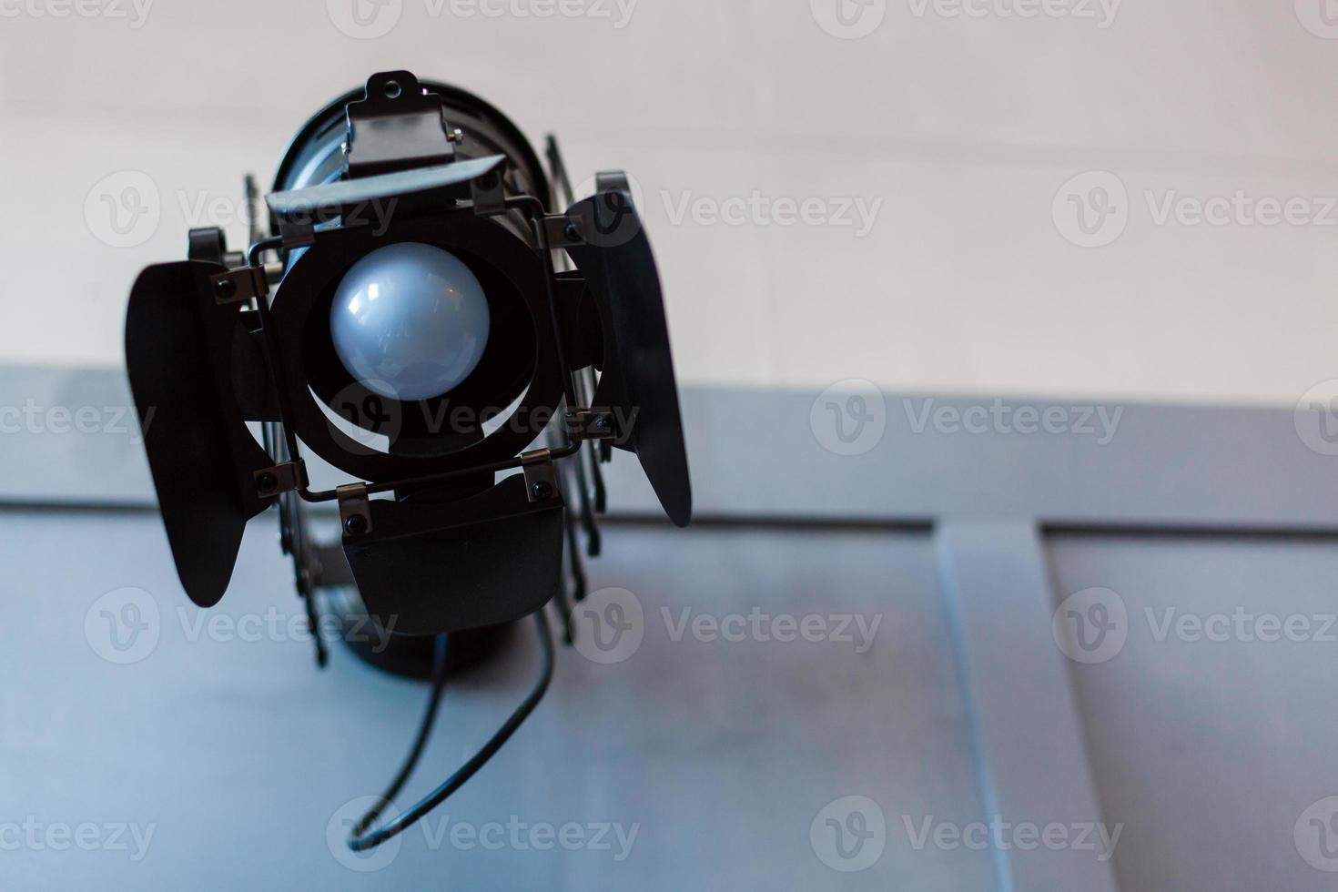 Halogen spotlight with a lens. Spot light on the wall. TV, video, photo, shooting photo