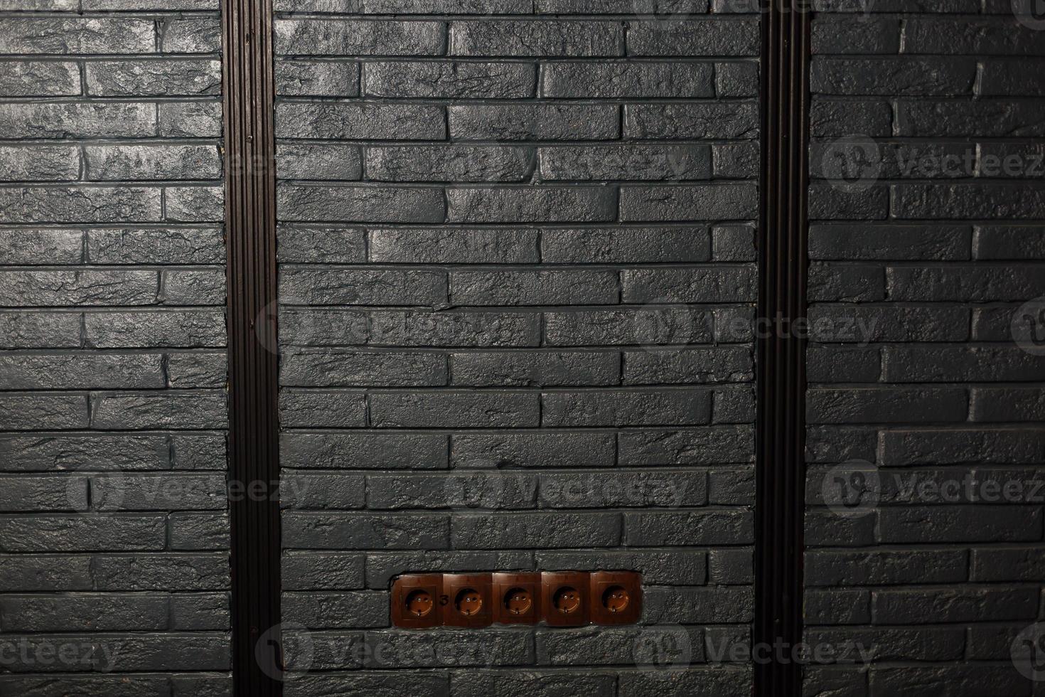 plug socket on brick wall photo