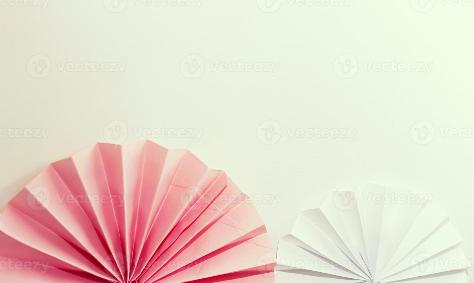 Pink and white striped paper fans photo