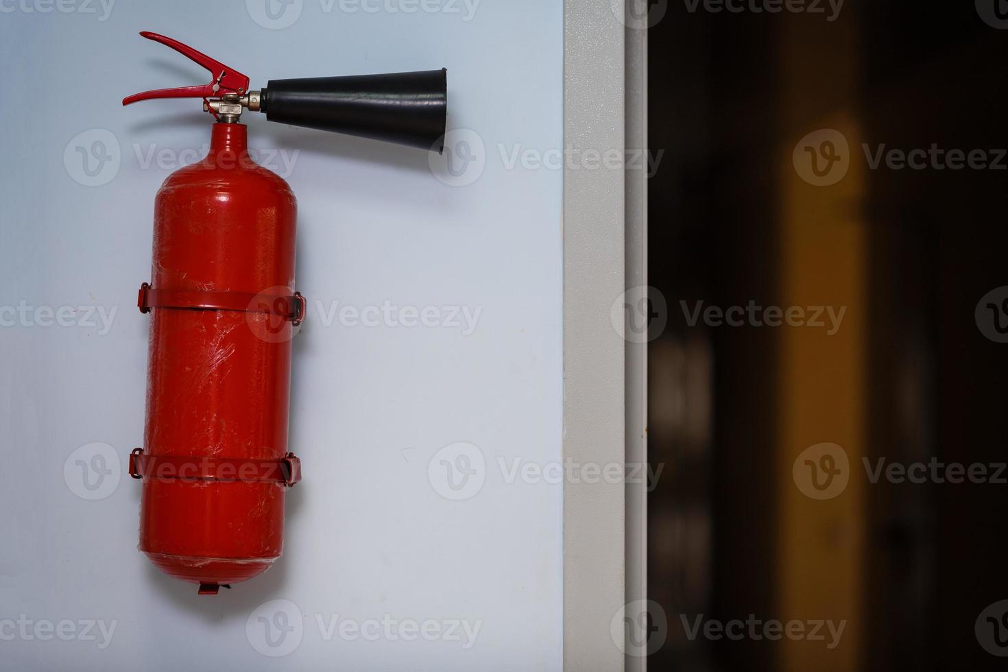 fire extinguisher on the wall photo