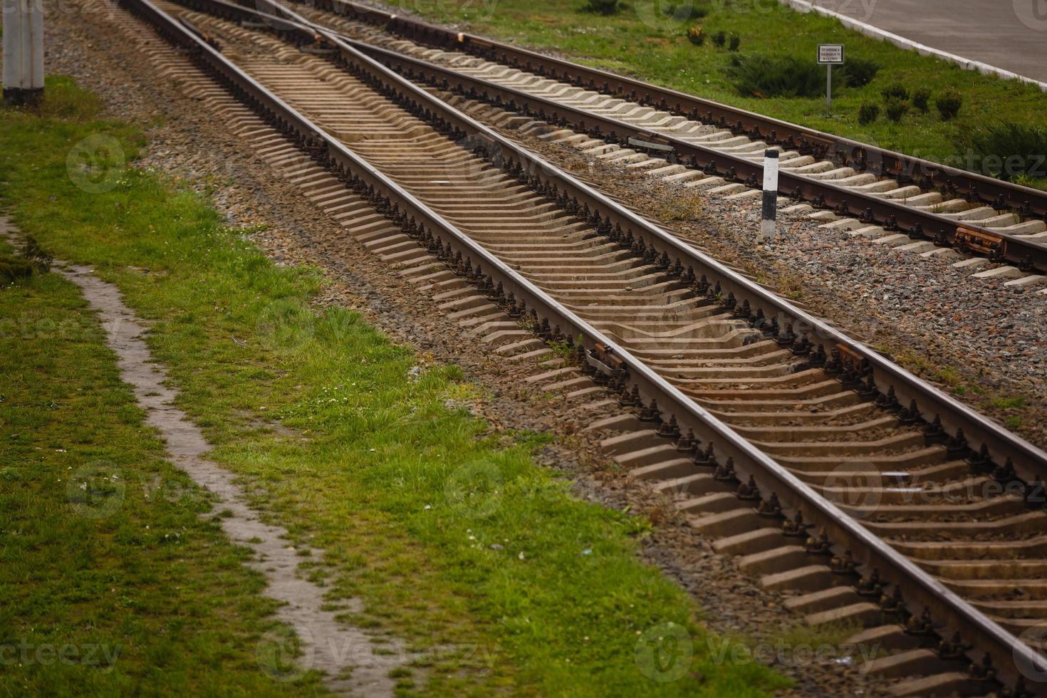 Two railway tracks merge photo