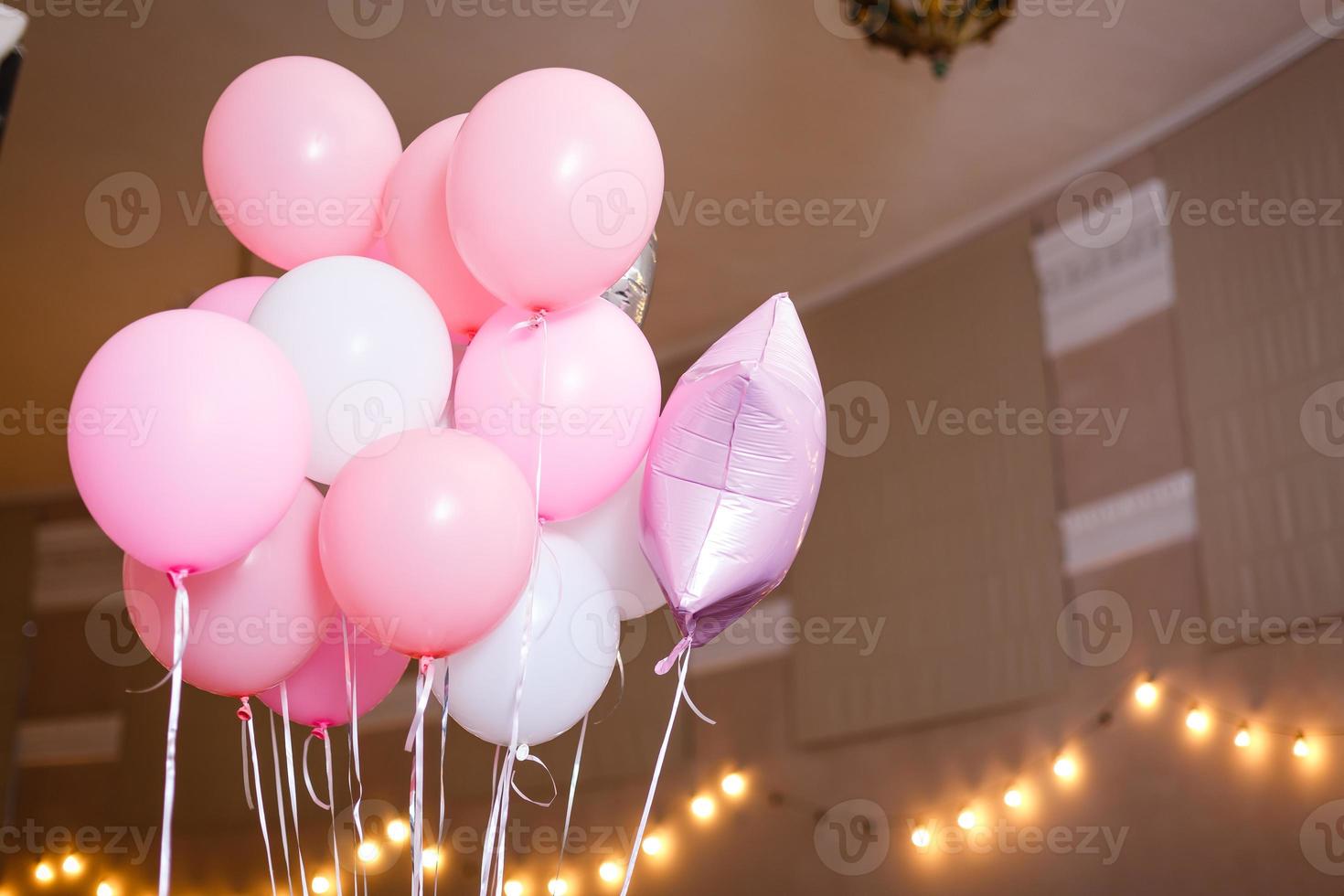 Decorations on birthday. White and pink balloons. photo