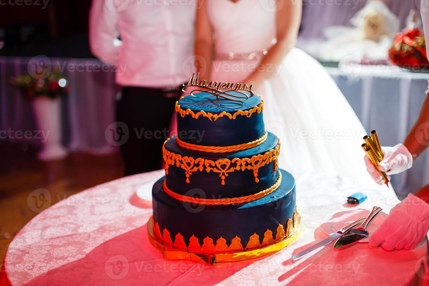 Wedding blue cake with edible gold leaf photo