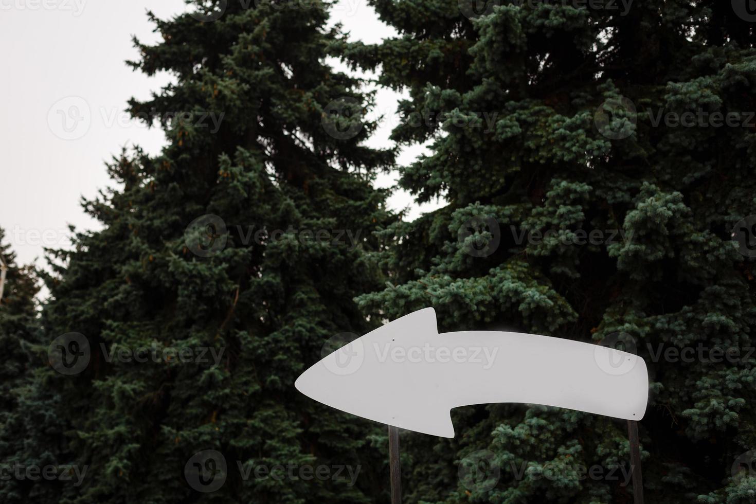 Wooden pointer arrow board for the inscription tourist concept photo