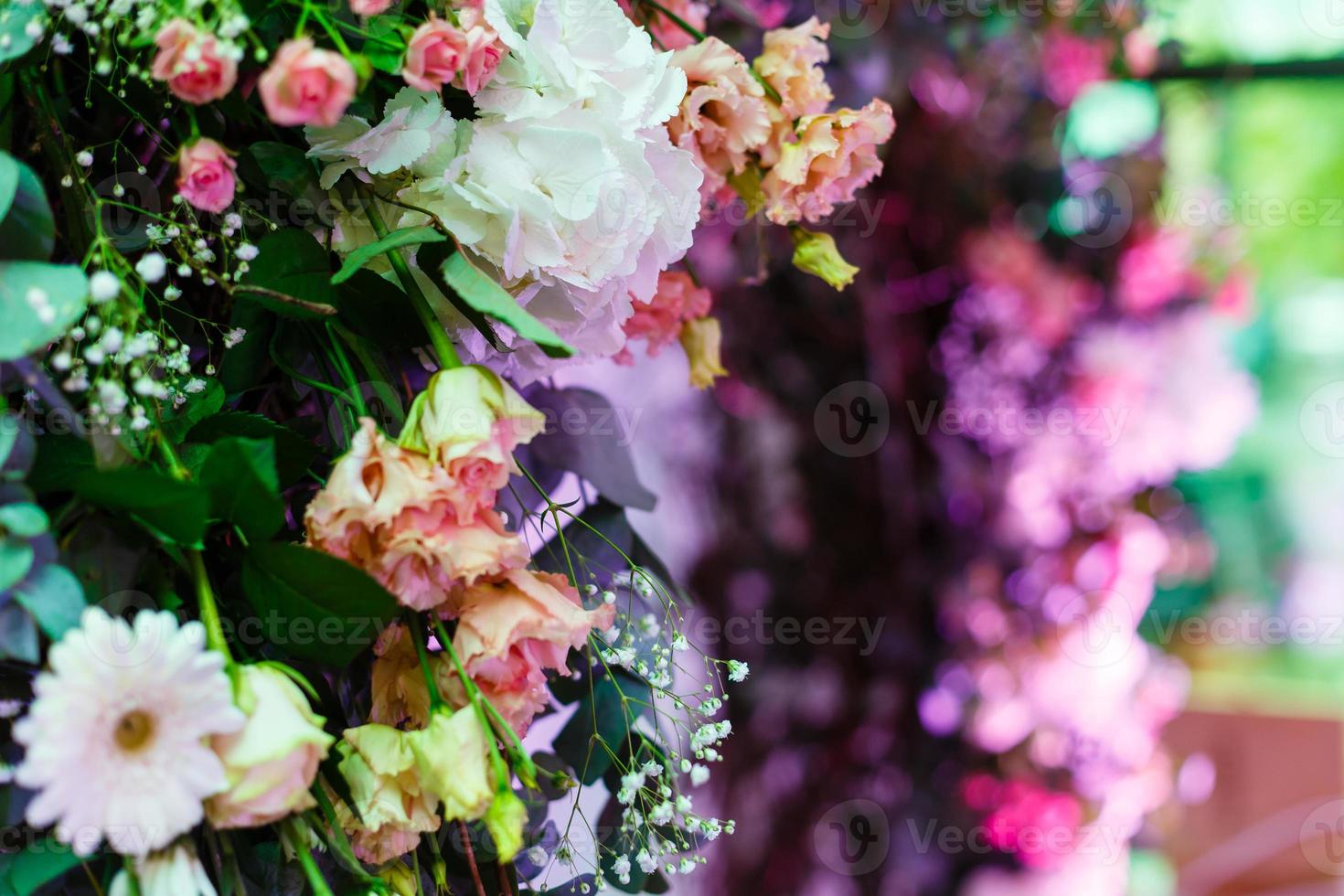 archway of many beautiful flowers, wedding arch with peonies Flowers for a wedding arch photo