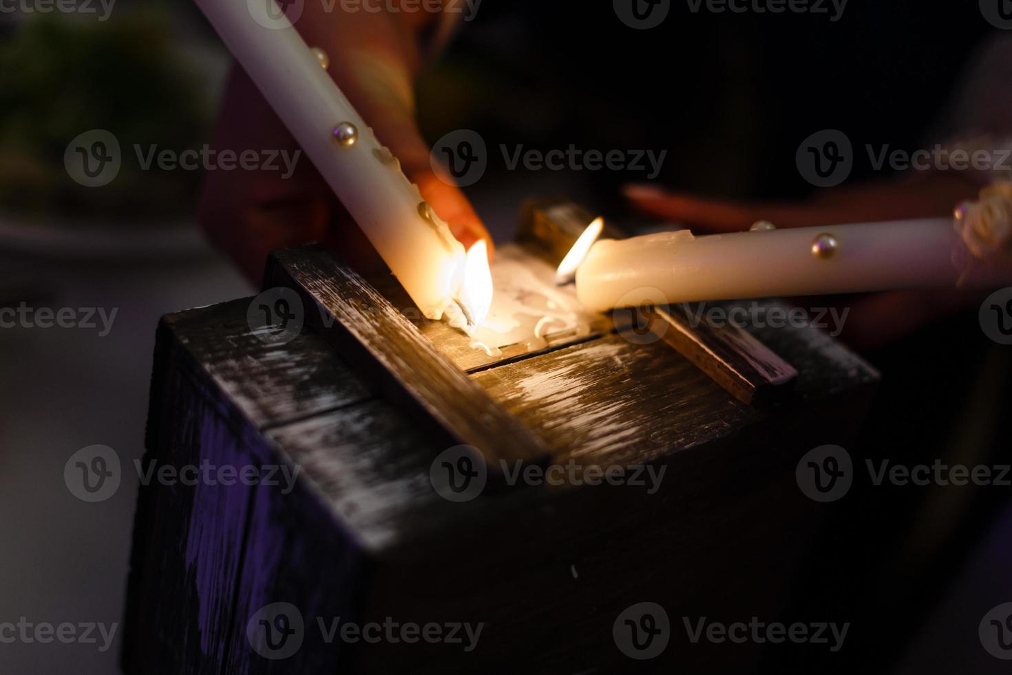 Two advent lights burning Two burning candles Wooden box photo
