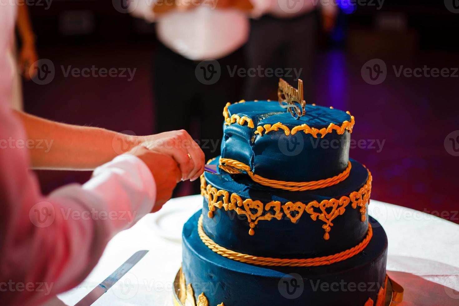 Wedding blue cake with edible gold leaf photo