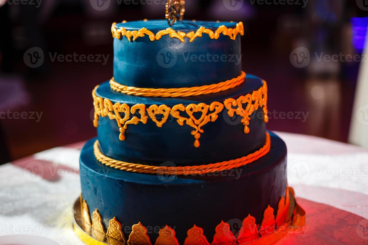 Wedding blue cake with edible gold leaf photo