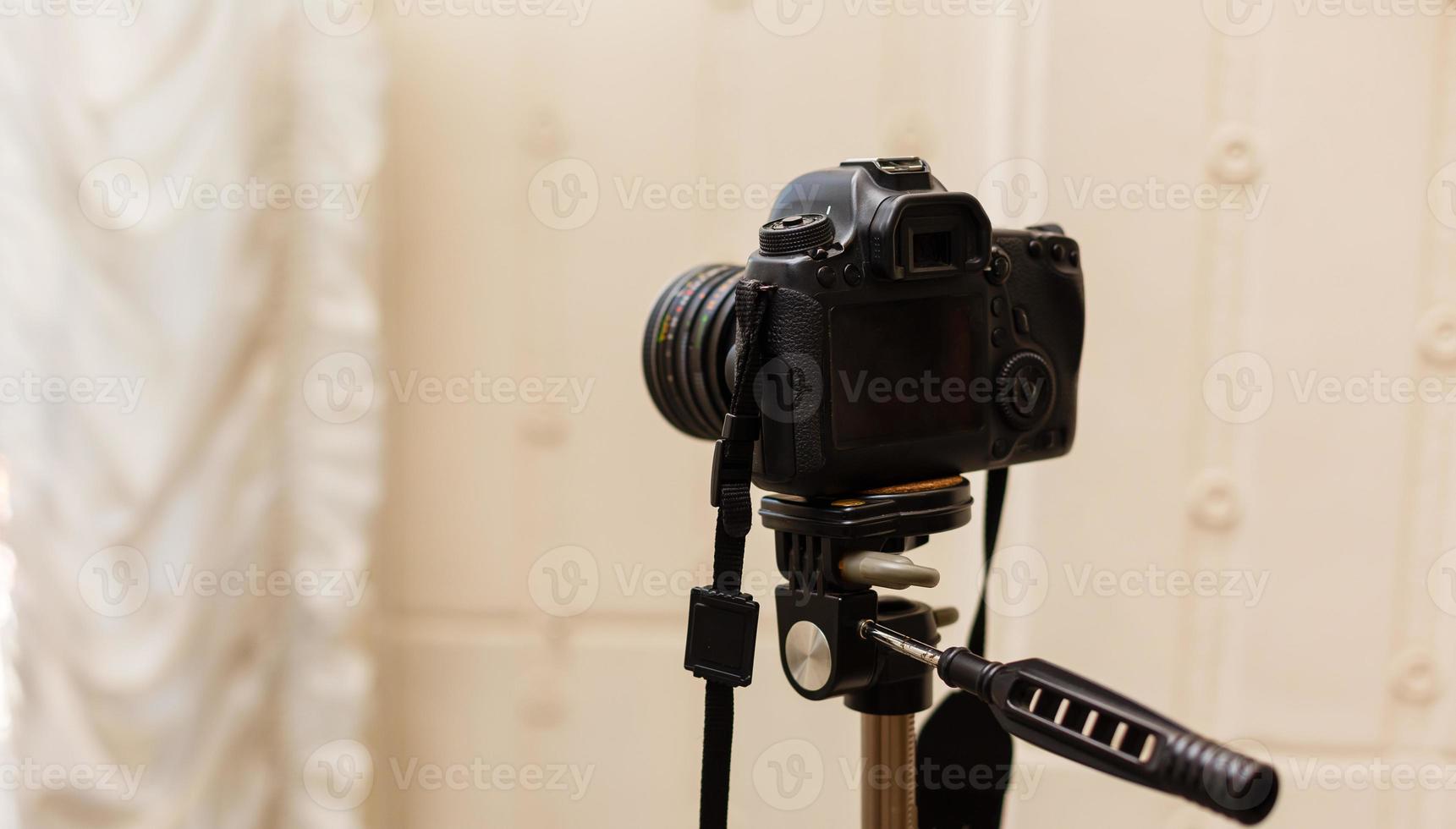 Digital single-lens reflex camera isolated on white background photo