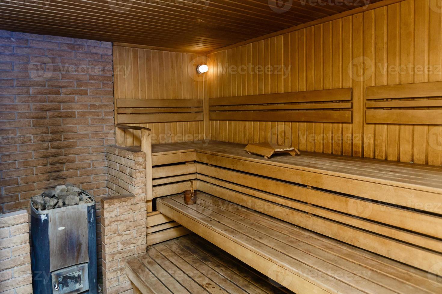 Sauna room with traditional sauna accessories photo