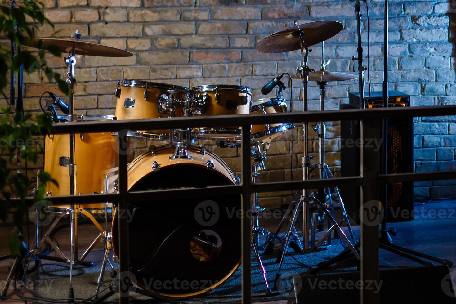 Modern drum set shot in smoky dark studio photo