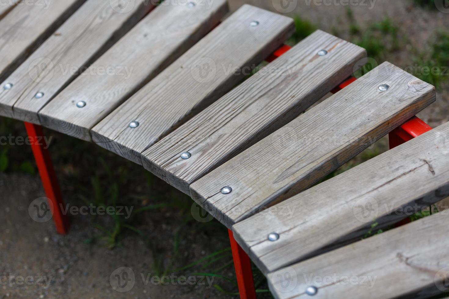 Wooden park bench in nature. A good place to sit photo