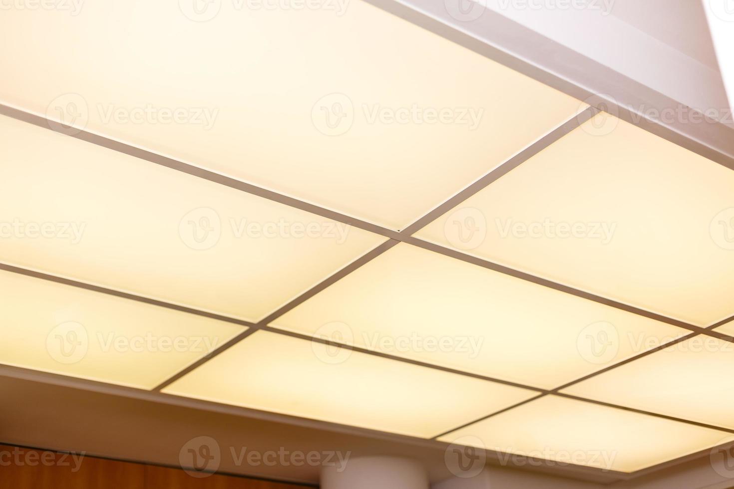 White ceiling with neon light bulbs in uprisen view photo