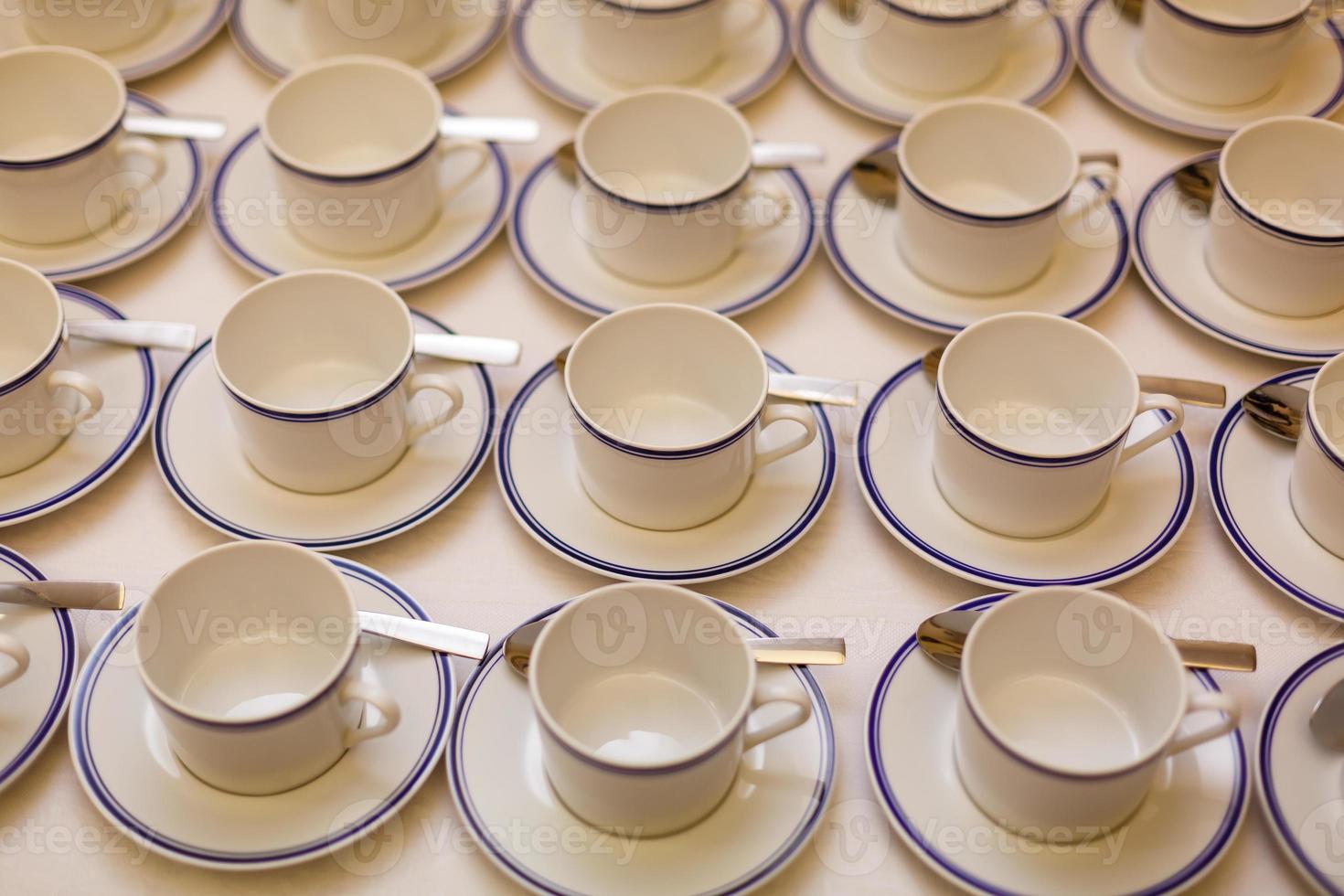 coffee cups served on white table as at coffee shop photo