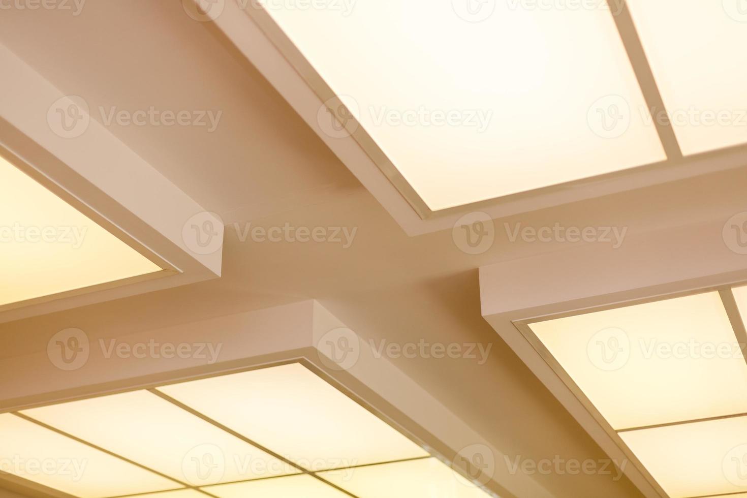 White ceiling with neon light bulbs in uprisen view photo