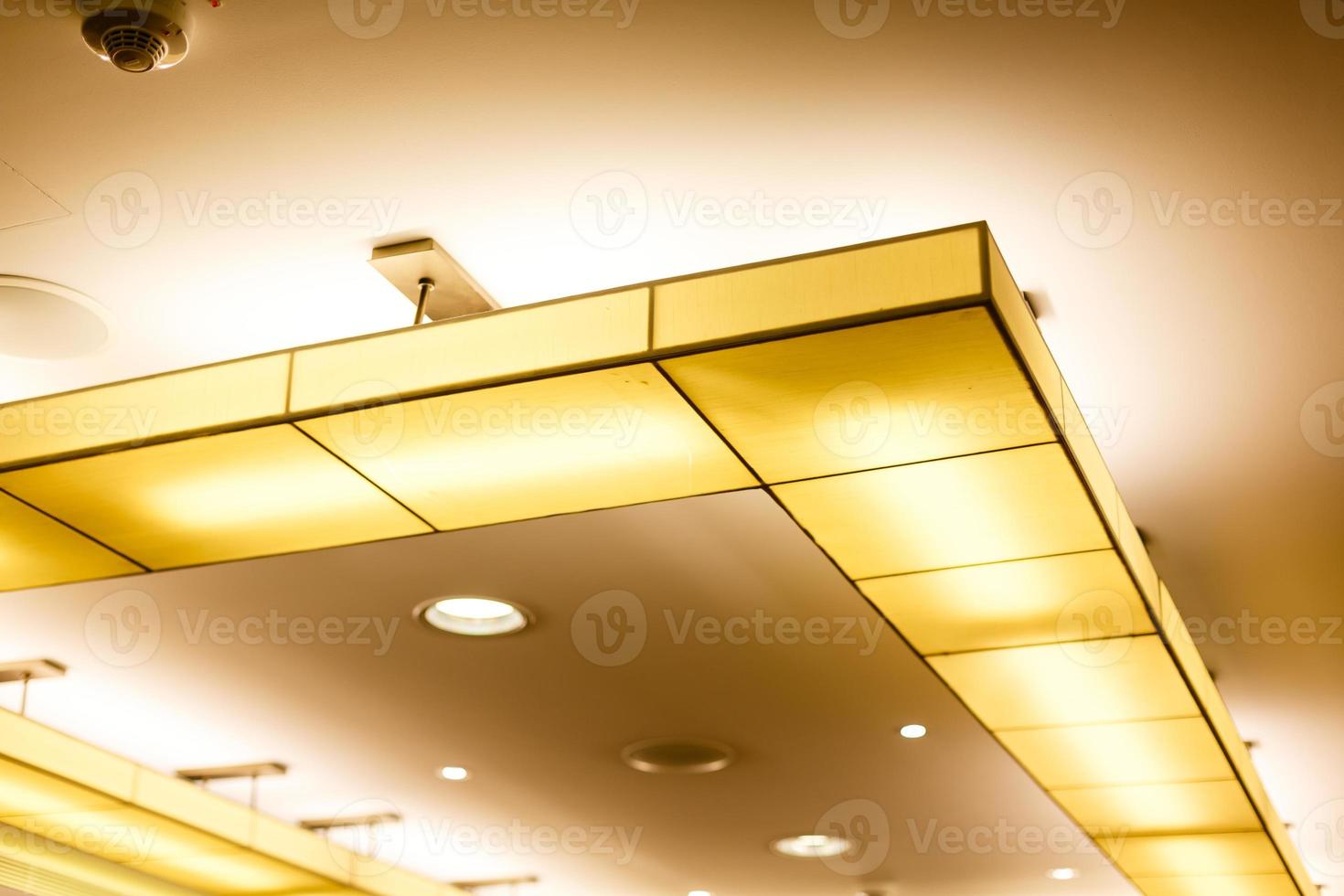 White ceiling with neon light bulbs in uprisen view photo