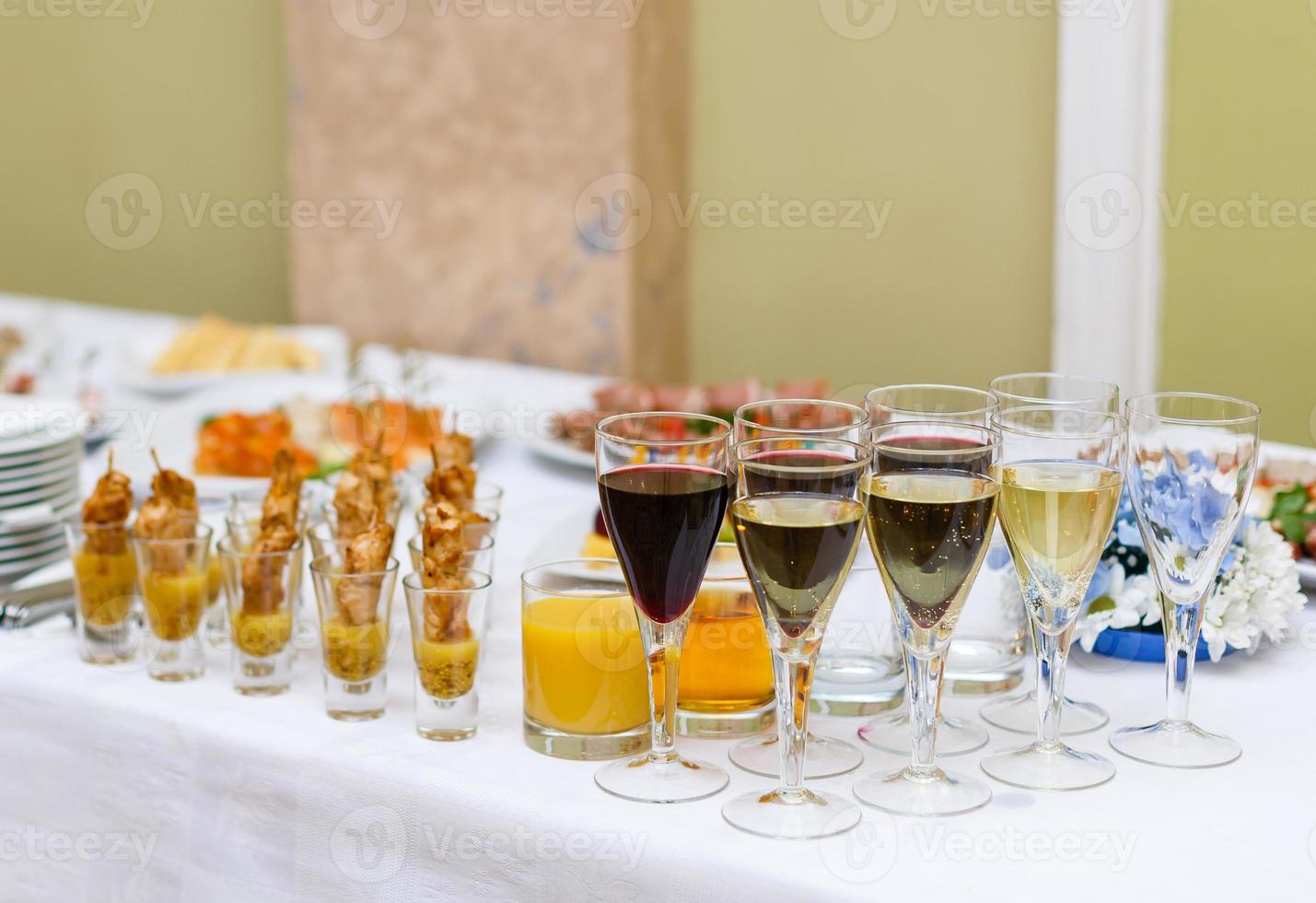 Delicious buffet table at a luxury event spread with a variety of cold meat platters and fresh colorful salad and vegetables photo