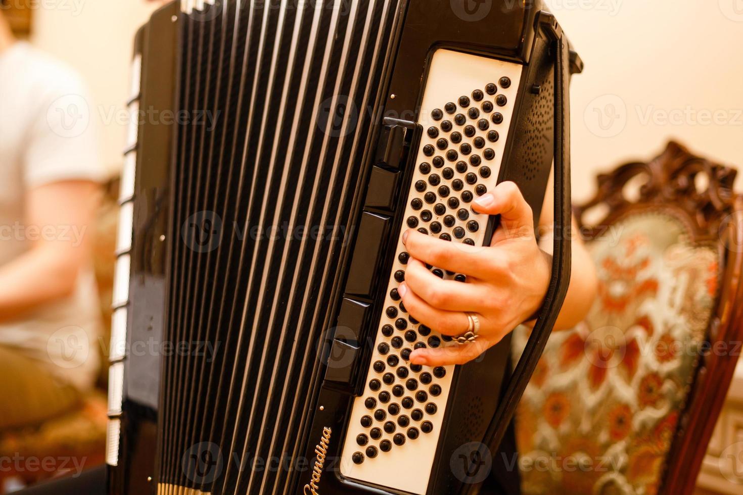 Accordion player The musician playing the accordion player instrument photo