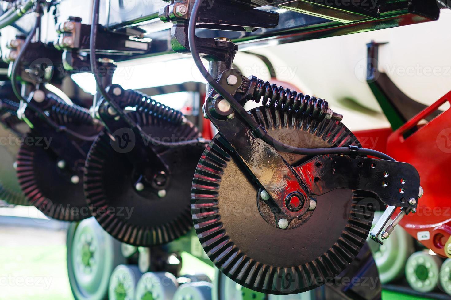 Agriculture equipment concept. Detailed closeup agricultural machinery, big wheels with tires. Outdoor shot photo