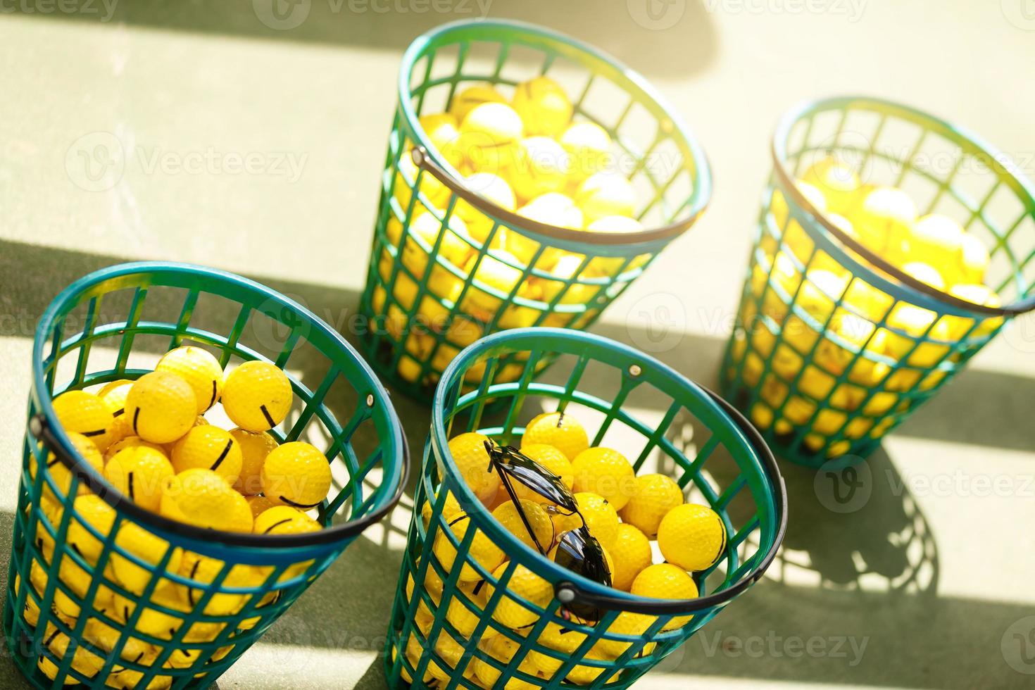 Golf balls pouring out of basket in Kiev golf club Golfstreem. 29 March 2015 Kiev. Ukraine photo