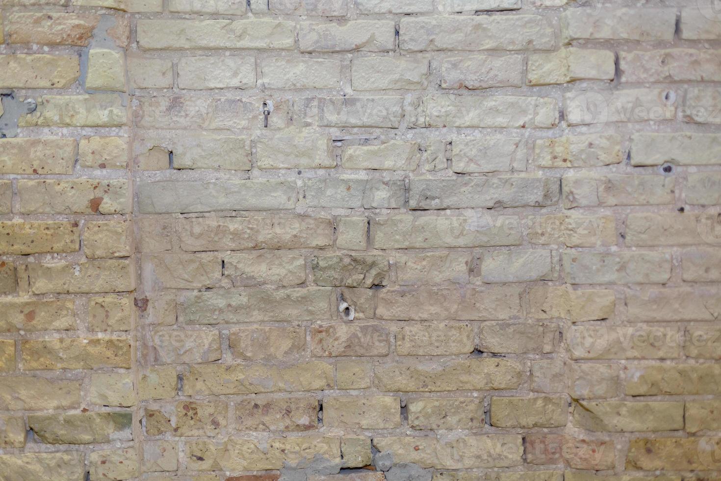 Beige Plastered Stone Wall Texture. Lime Wash Brick Wall Seamless Abstract Background. Pastel Brickwall Beige Wallpaper. Vintage Stonewall Wall With Beige Plaster. Horizontal Bricklaying Texture. photo