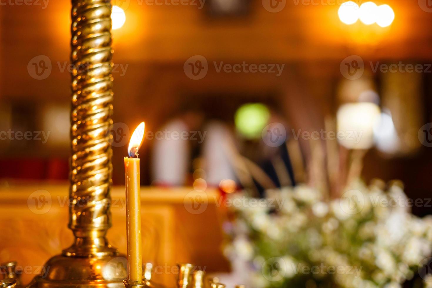 Burning candles in a church photo