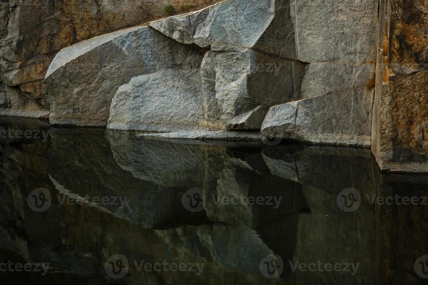 Quarry rocks with reflection photo