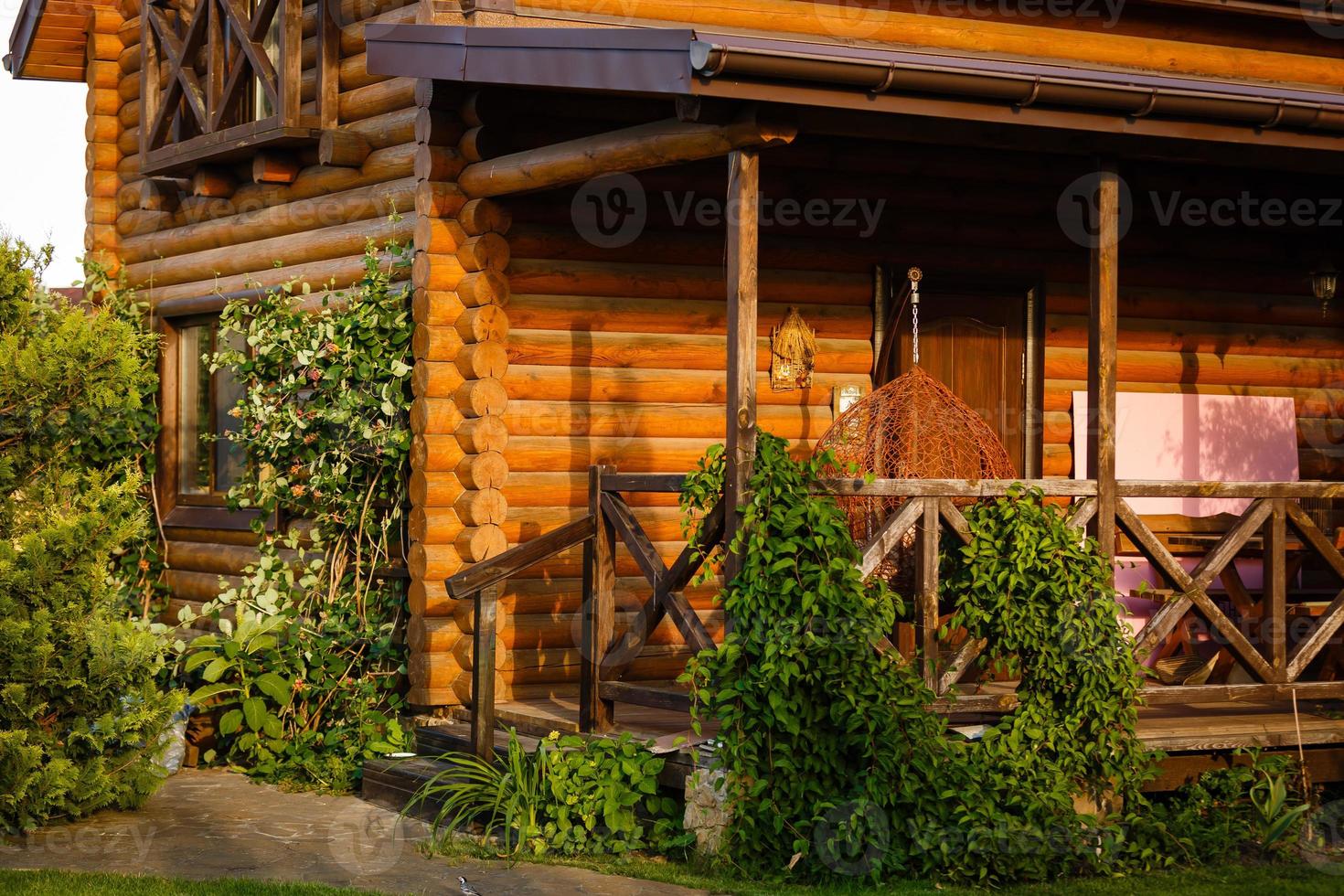 Modern Log Cabin Home in a Forest Environment photo