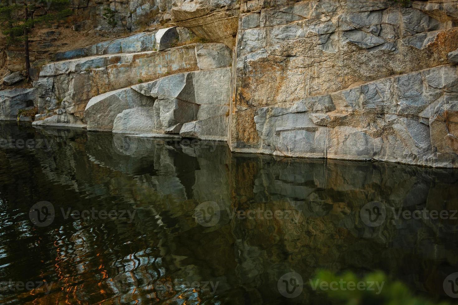 Quarry rocks with reflection photo