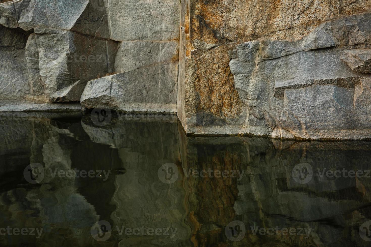 Quarry rocks with reflection photo