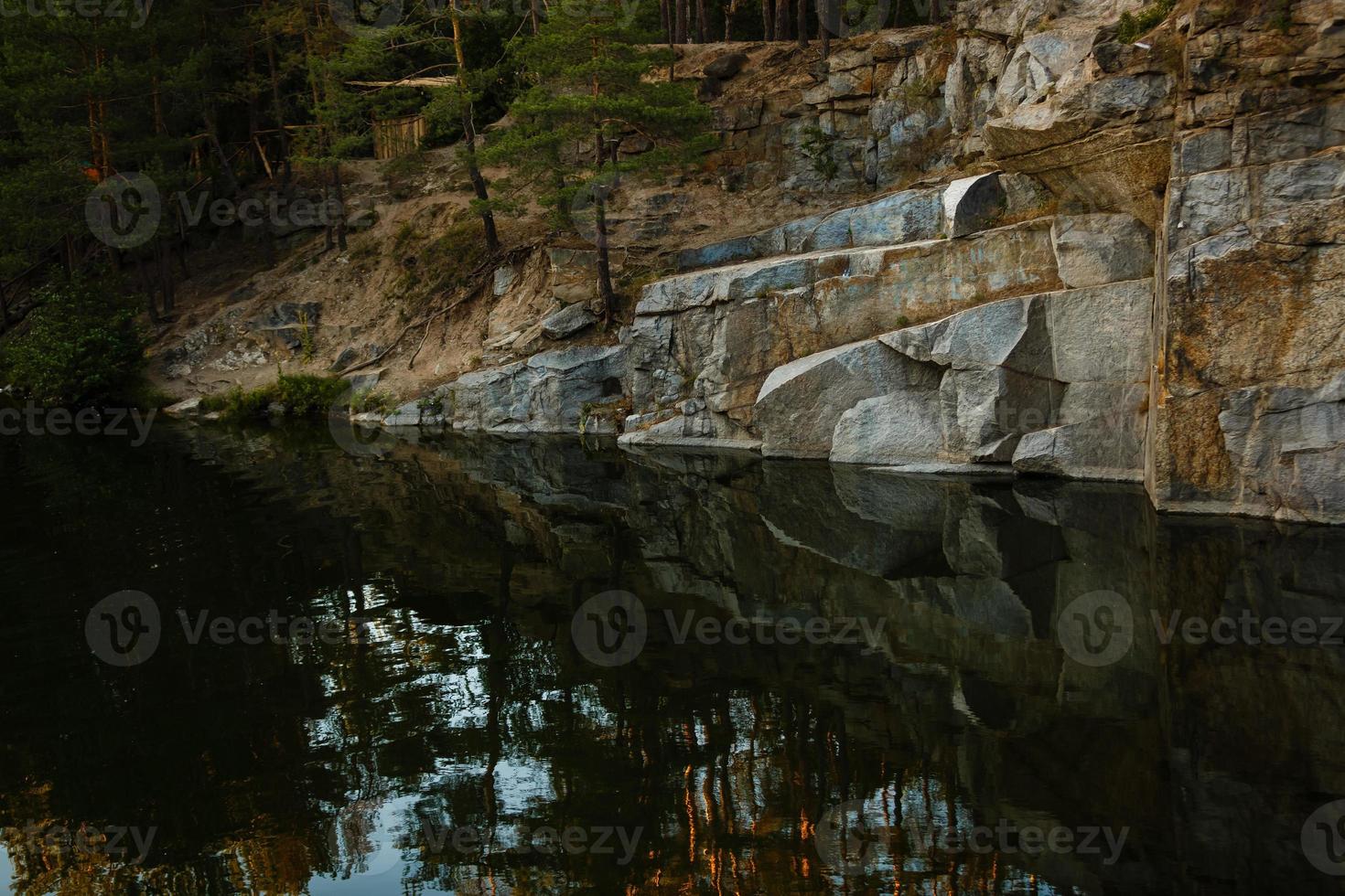 Quarry rocks with reflection photo