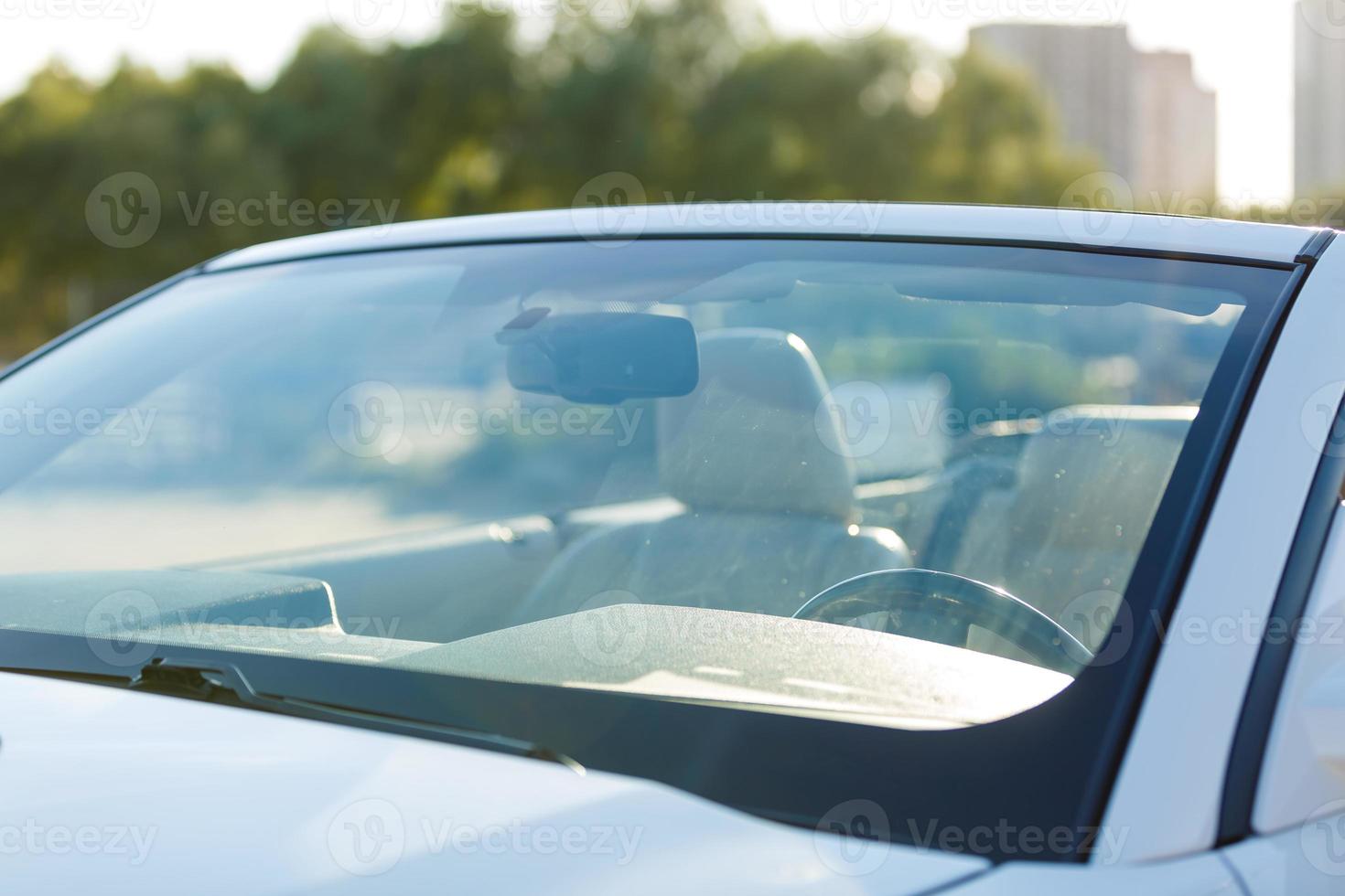 close up of car windshield rain wipers photo