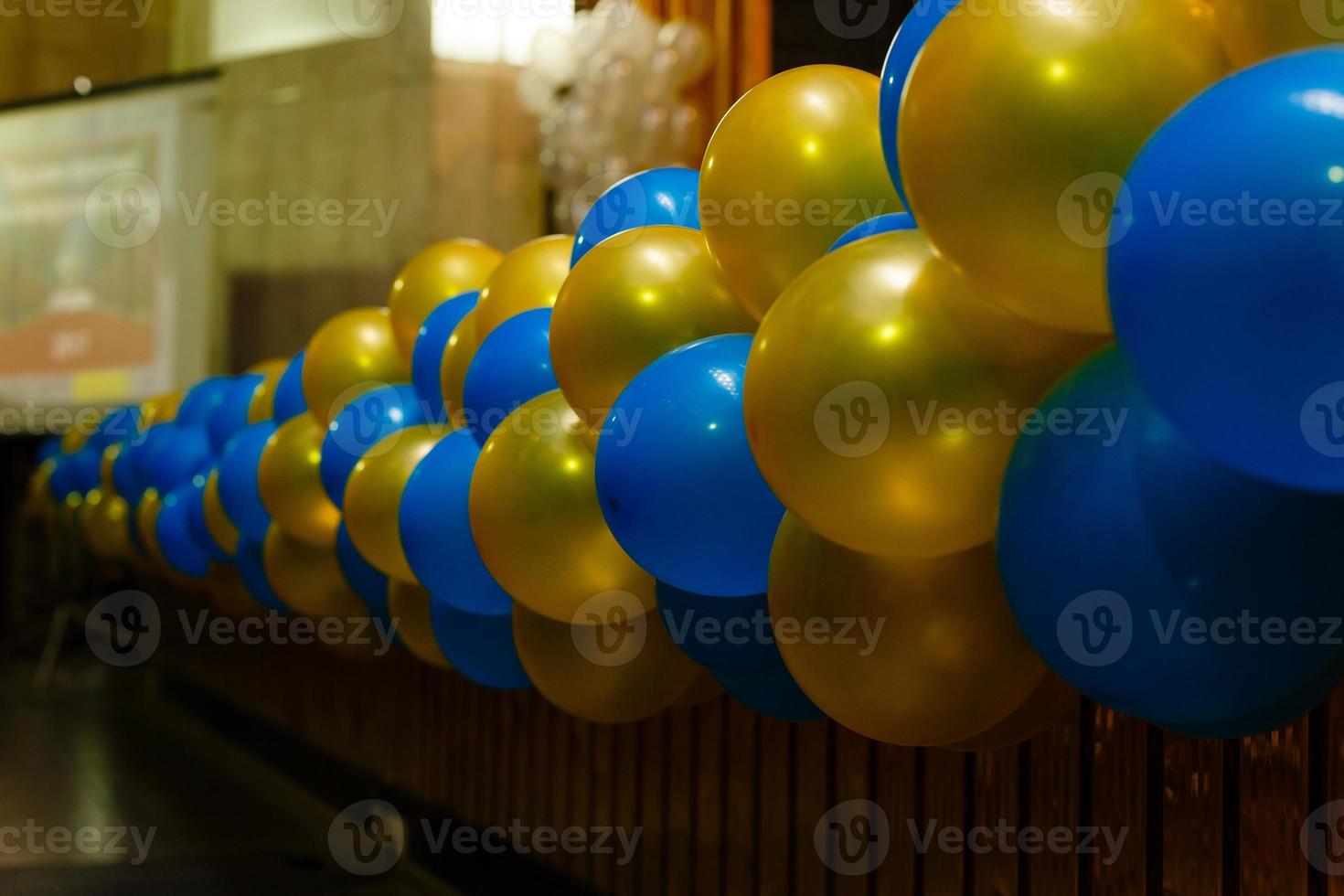 Color balls, colored polymer gel, hydrogel beads against the background of the wall and the falling rays of the sun emanating from the window. Concept holiday, birthday, congratulations photo