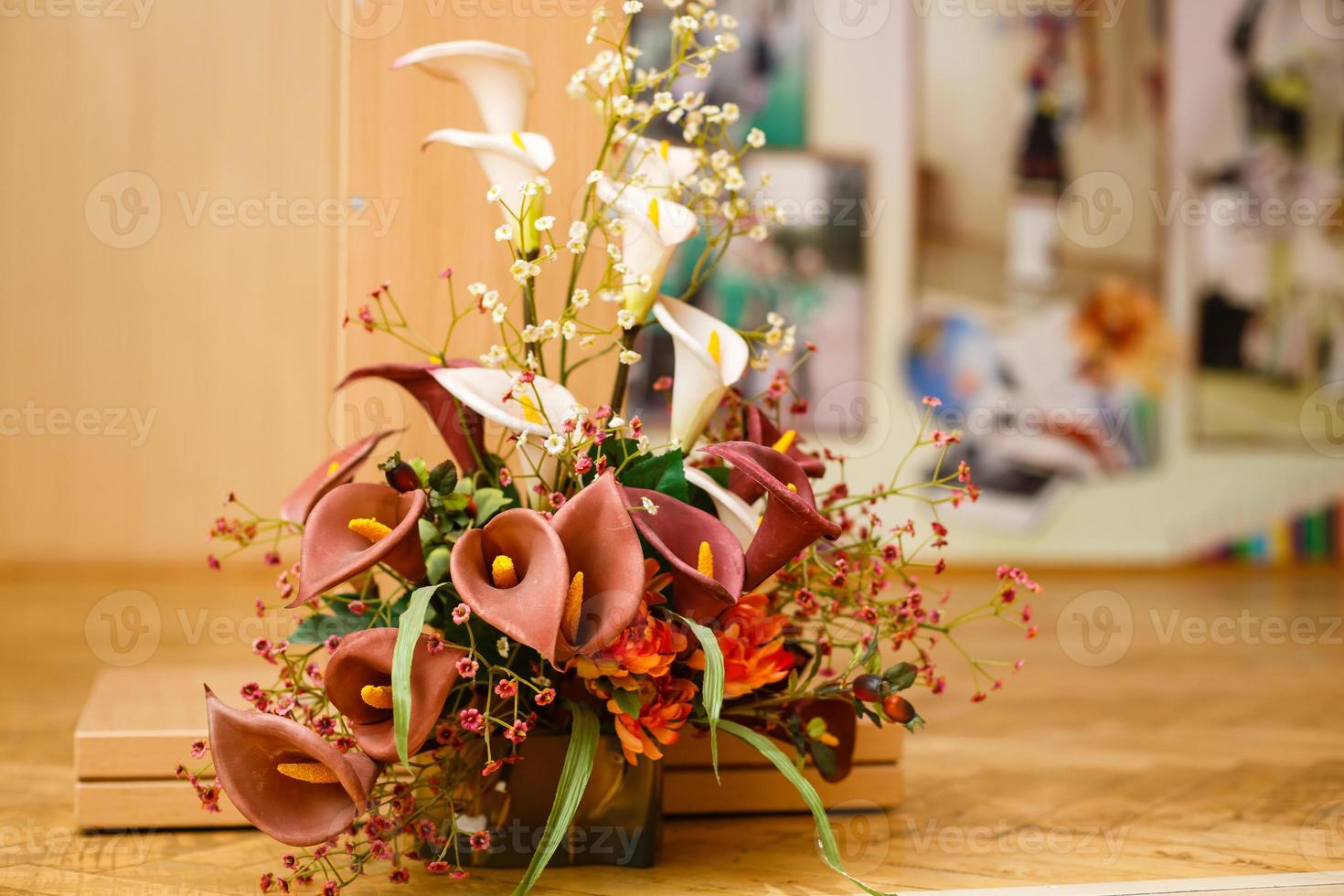 Still-life with a melon and a fragrant lily, an appetizing fragrant juicy ripe melon and a bright gentle fine yellow lily in a transparent jug photo