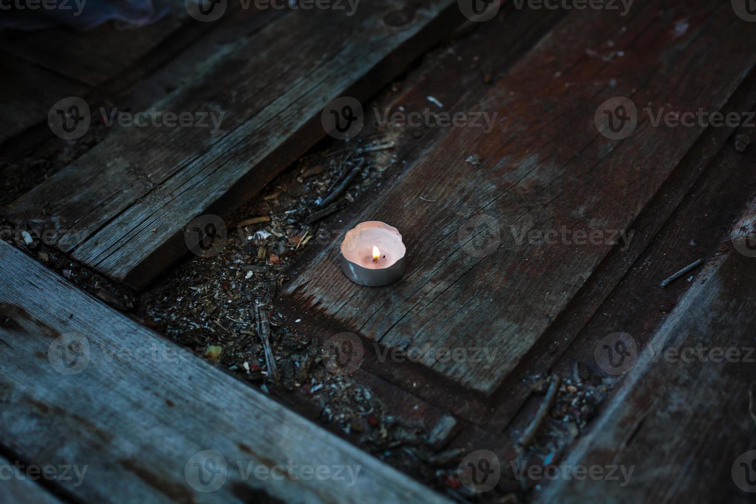 on a wooden bridge on the river at dusk romantic arrangement of burning candles photo