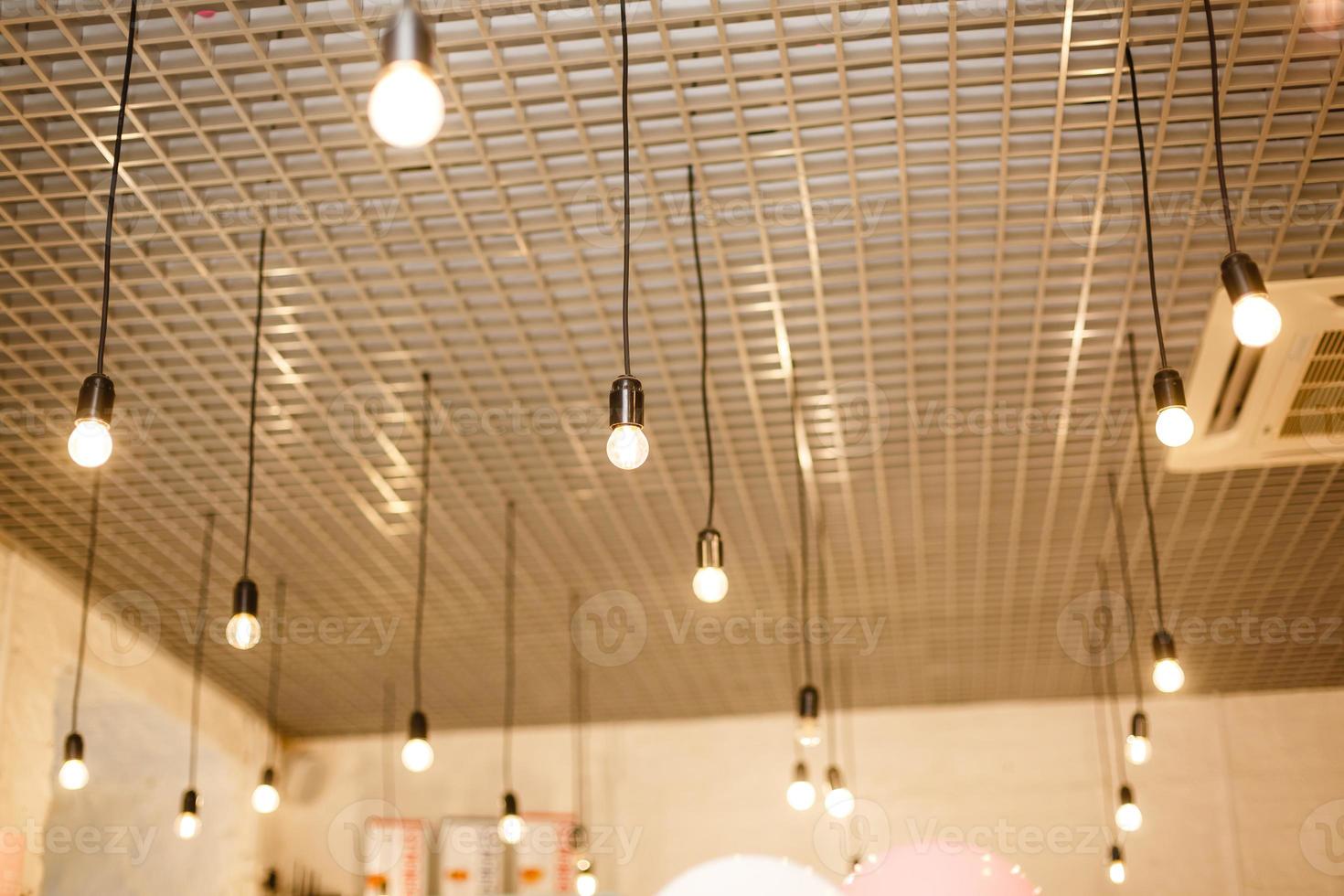 Vintage style light bulbs hang and decorated photo