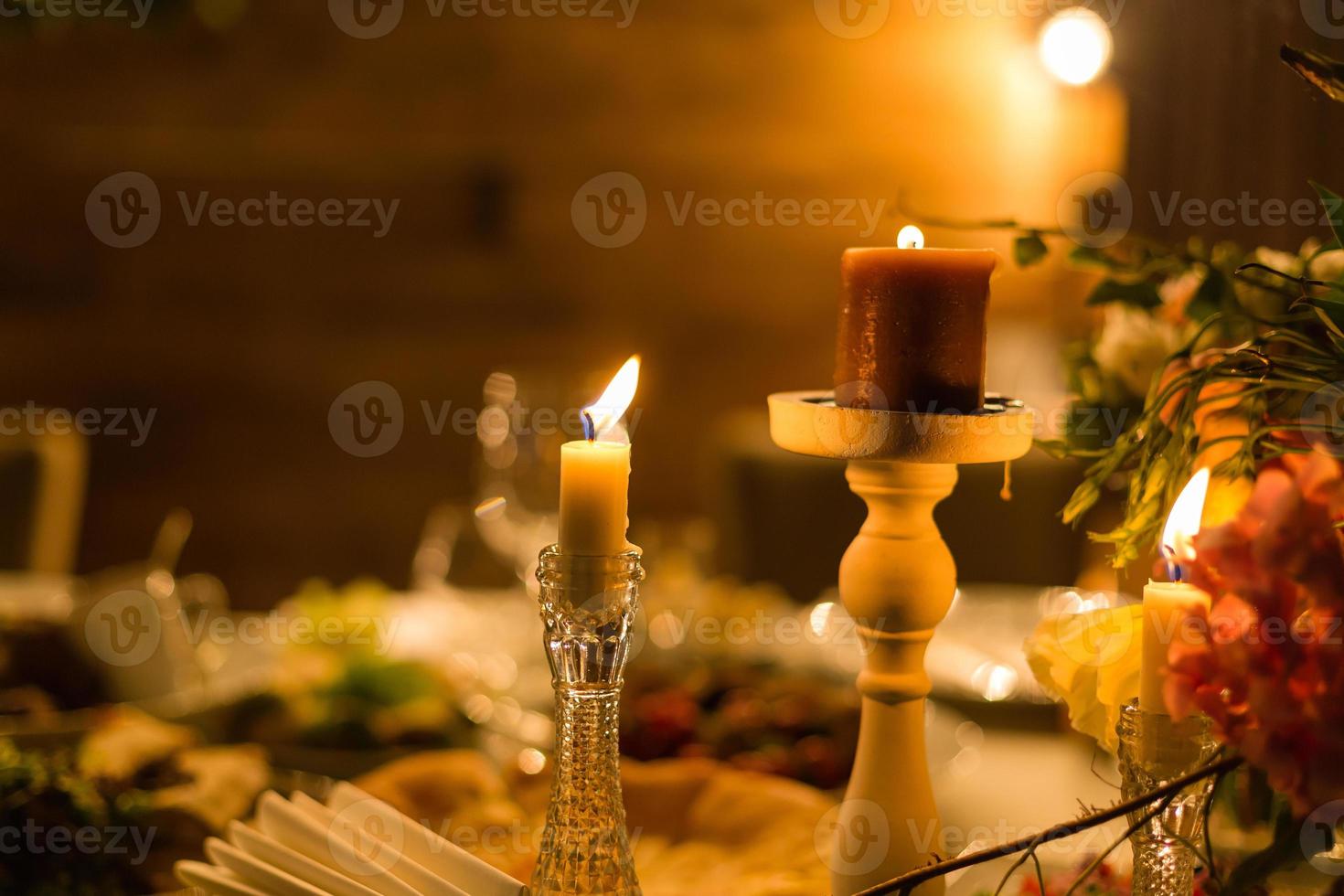 Candle in a crystal candlestick photo