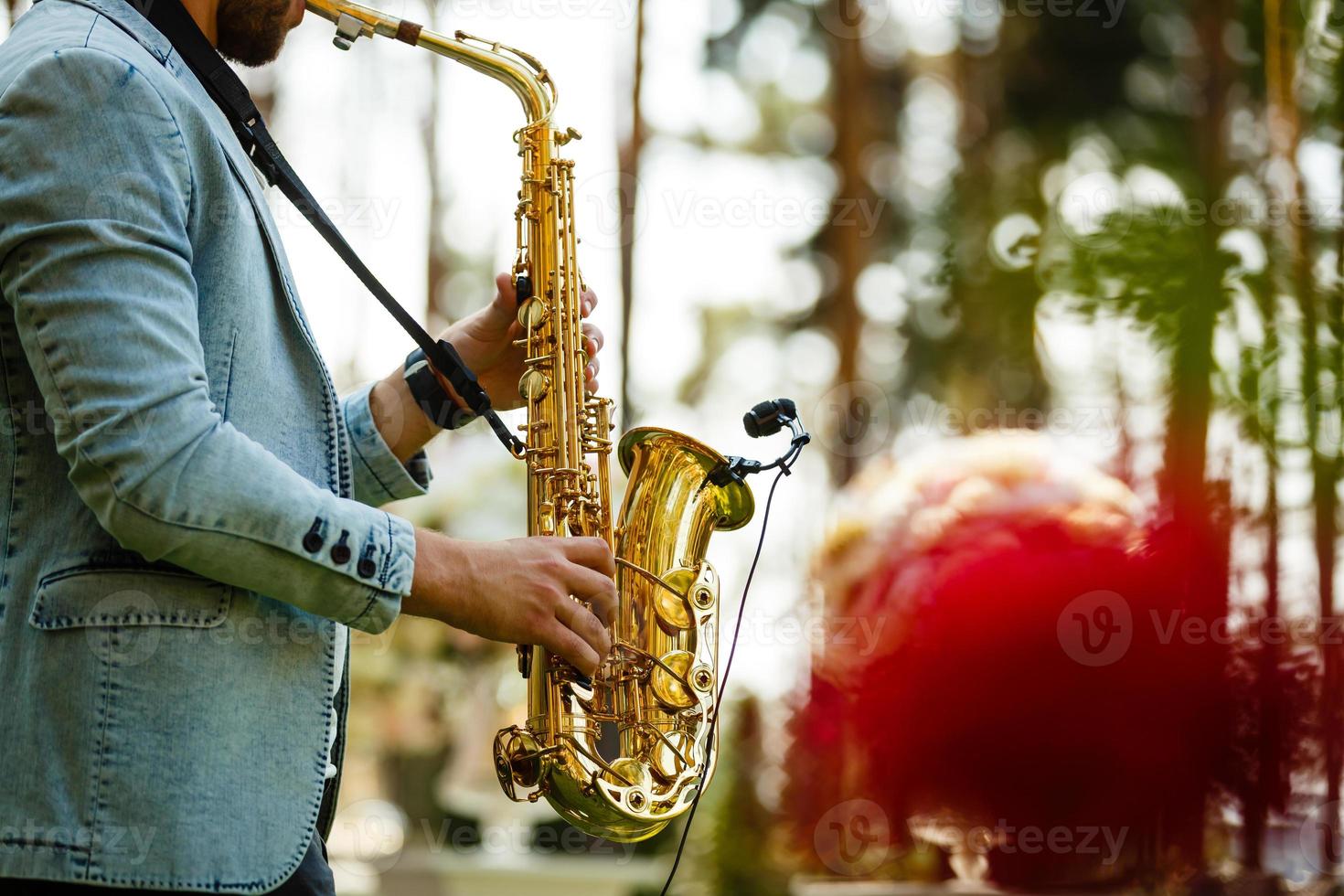 World Jazz festival. Saxophone, music instrument played by saxophonist player musician in fest. photo