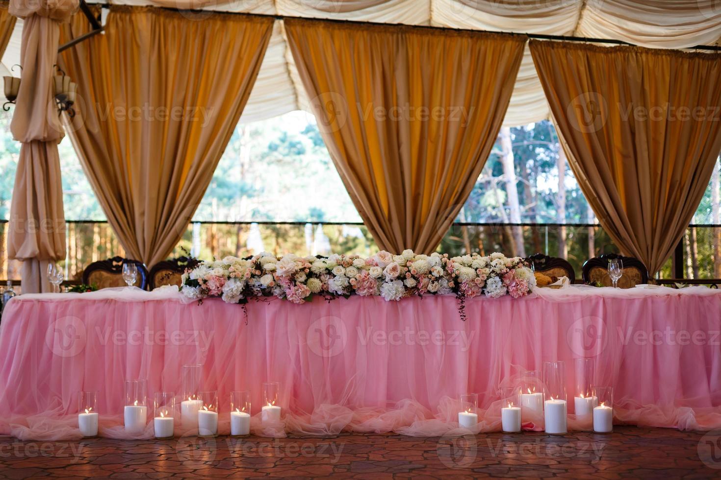 a laid wedding banquet table at a restaurant photo