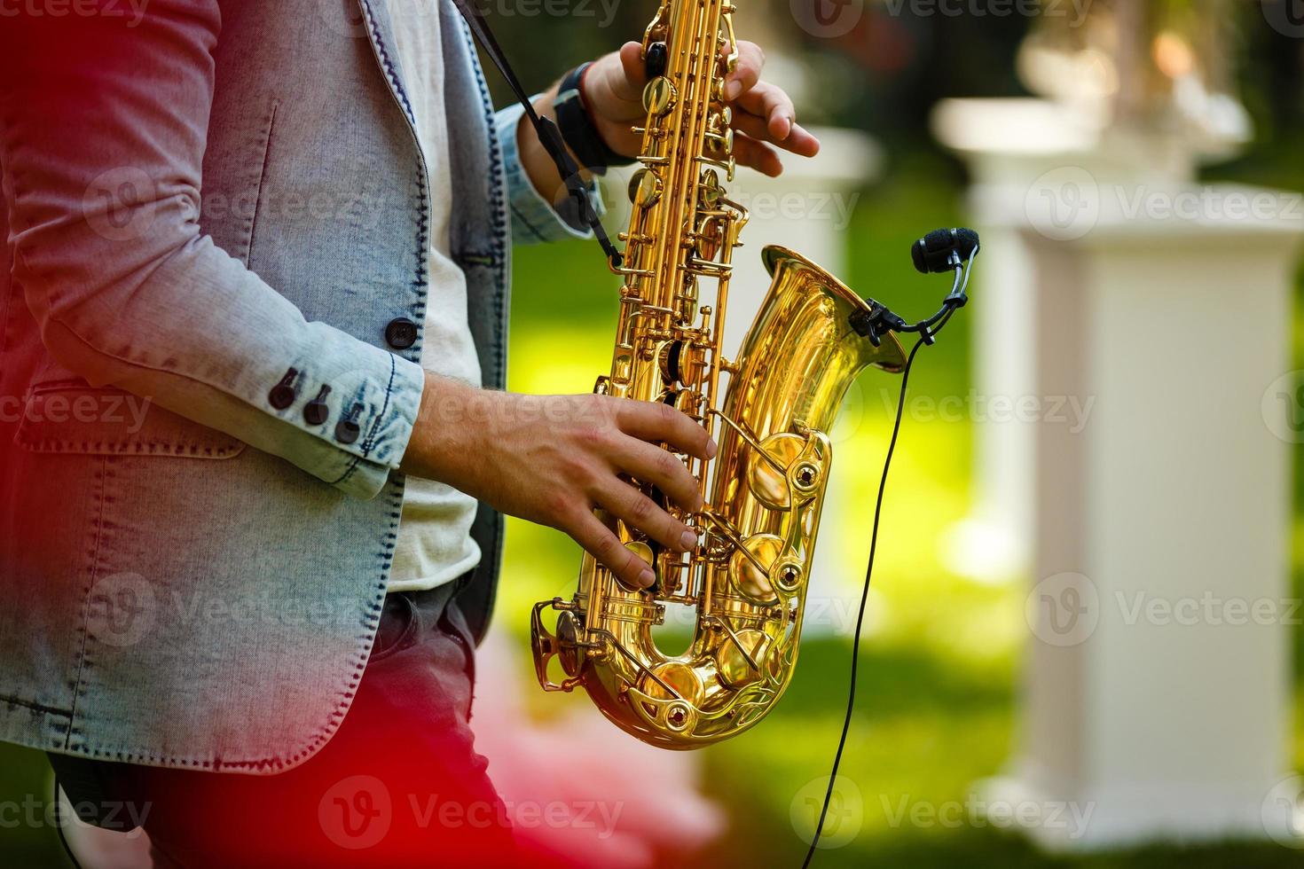 World Jazz festival. Saxophone, music instrument played by saxophonist player musician in fest. photo