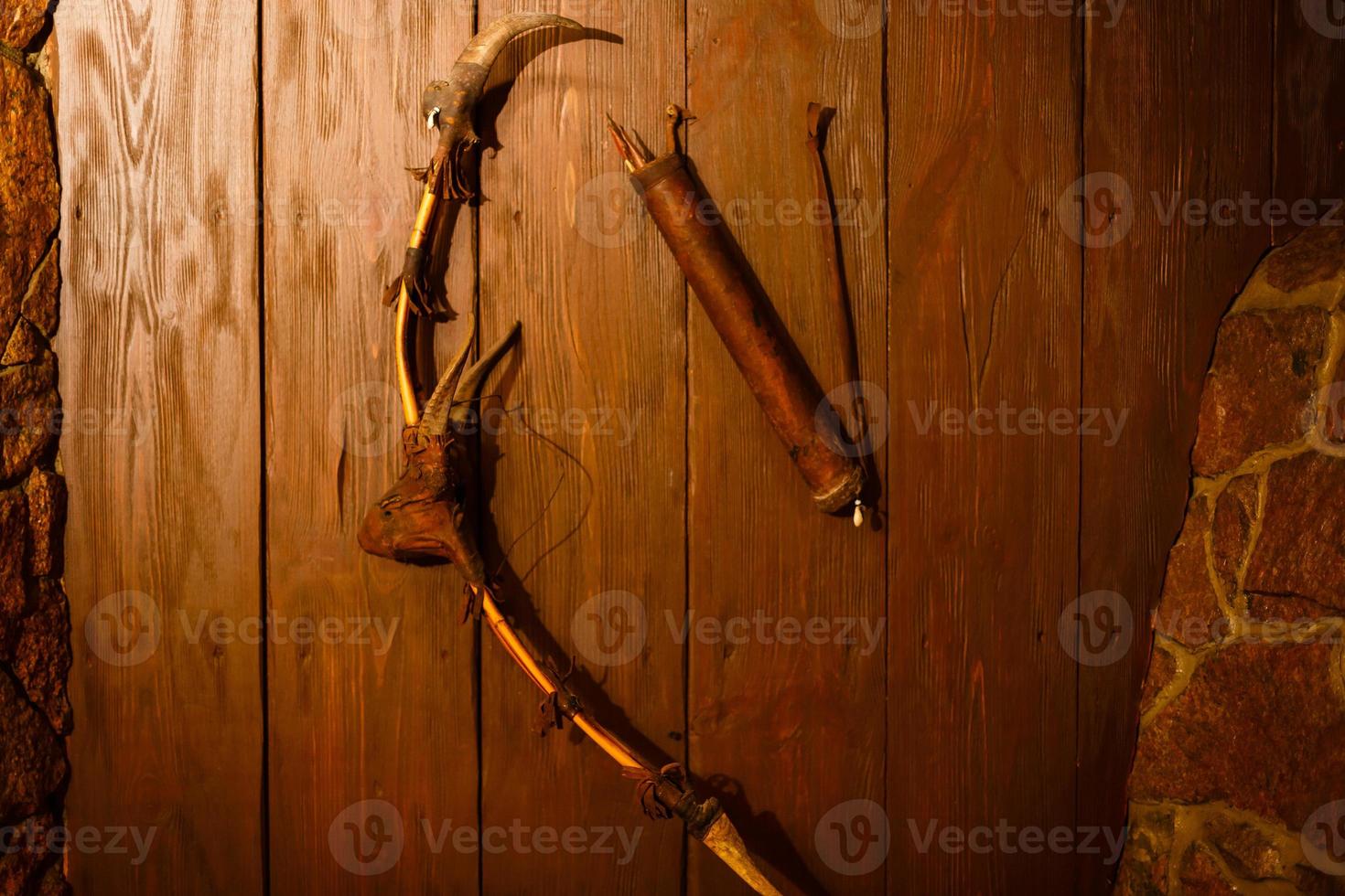 ancient spear and bow isolated on white background photo