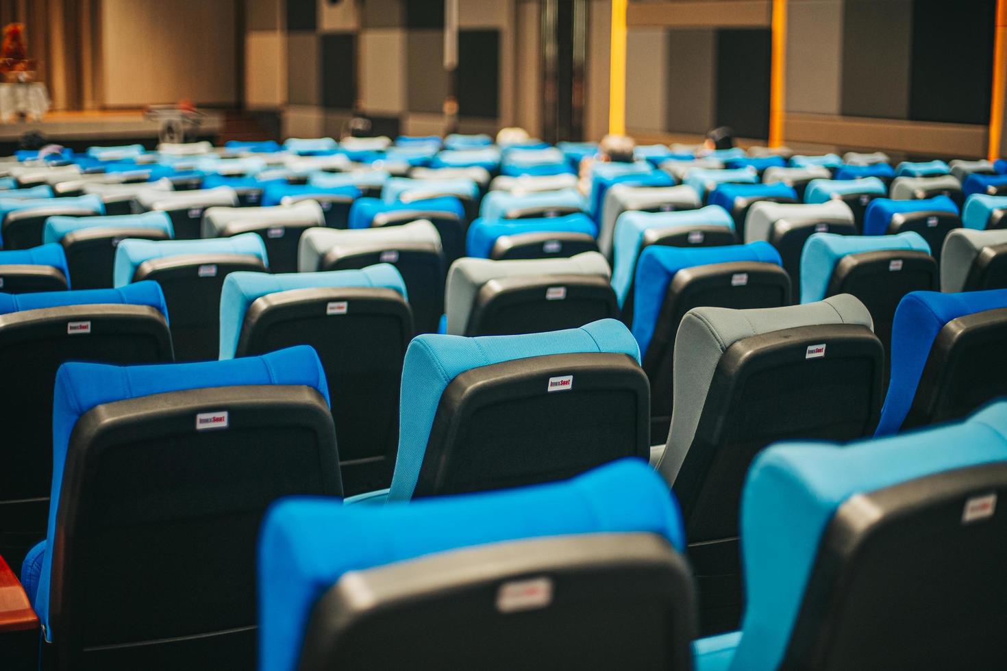 Empty blue cinema seats, chairs. Perspective view photo
