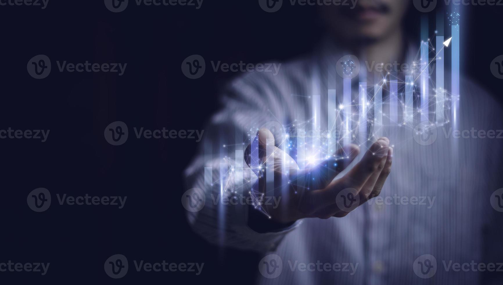 Businessman holding a graph goal of business Investor,analysis economic and calculates financial data and target for long-term investments and profitability in future on digital data system manager. photo