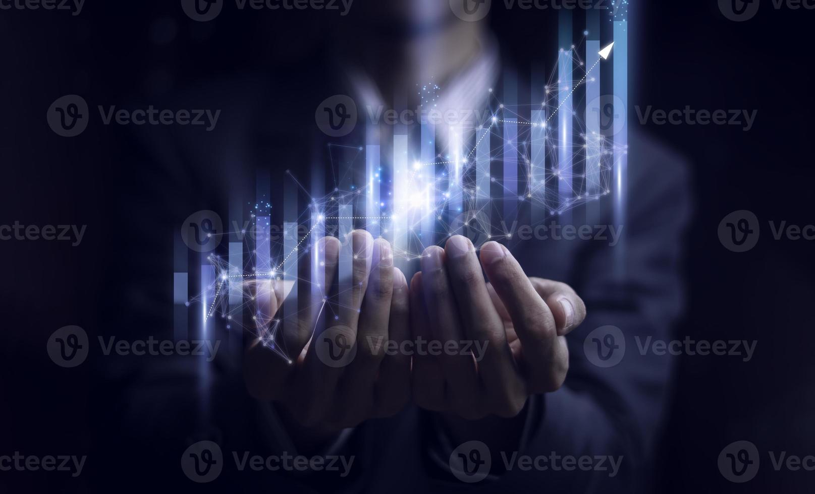 Businessman holding a graph goal of business Investor,analysis economic and calculates financial data and target for long-term investments and profitability in future on digital data system manager. photo